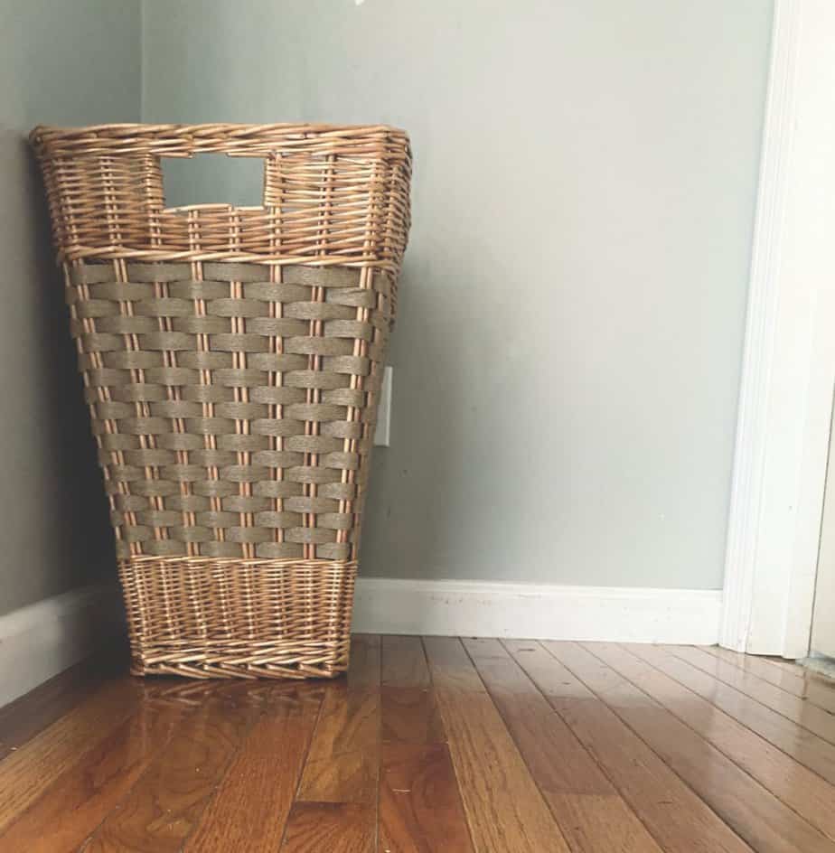 eco friendly wicker laundry basket in hallway