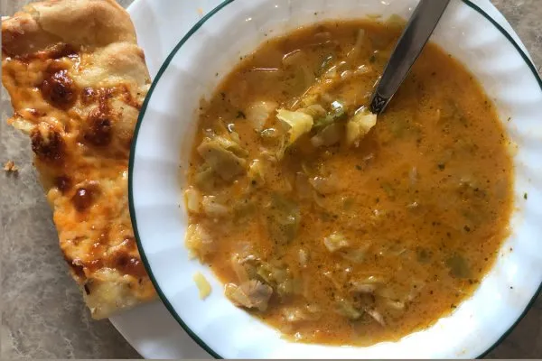 homemade cabbage soup with flatbread on the side