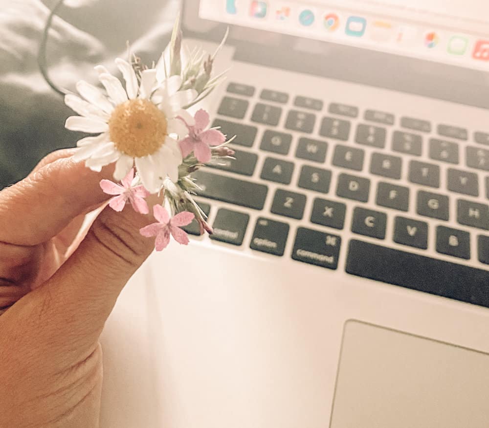 tiny bouquet in front of open laptop