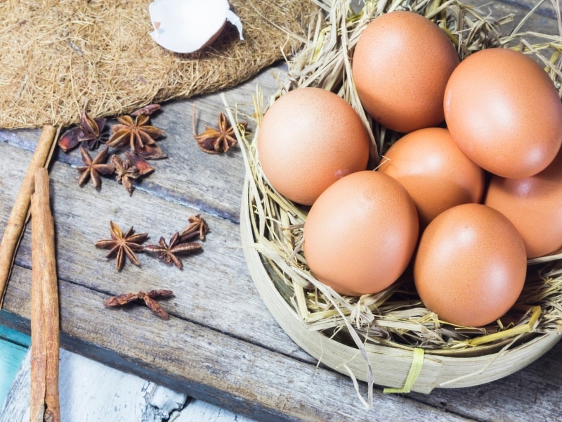 farm fresh eggs on wooden table