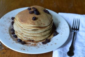 cinnamon einkorn sourdough pancakes topped with raisins