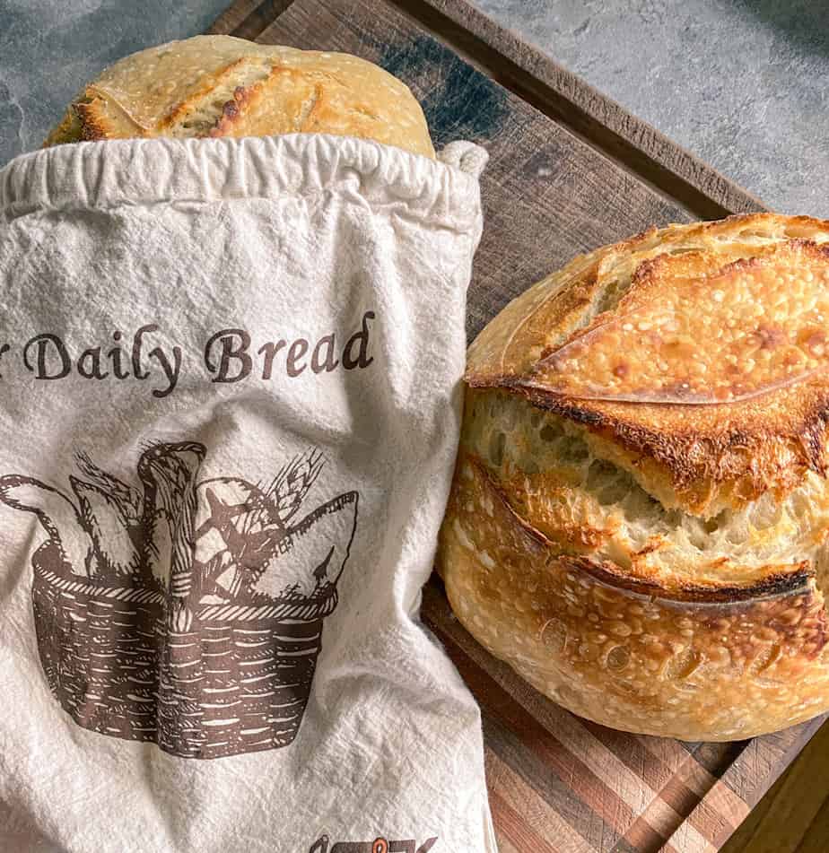 fresh sourdough bread stored in a linen bread bag