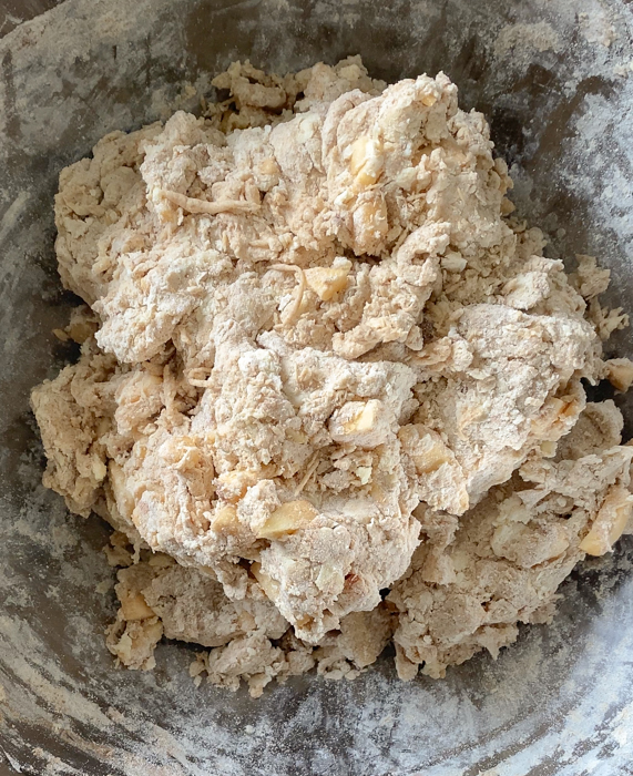 Sourdough einkorn scone dough with apples and cinnamon mixed in.