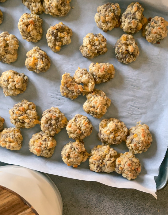 Baked sausage balls on parchment paper.